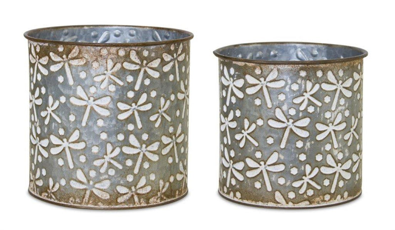 Two metal planters with floral pattern on a white background