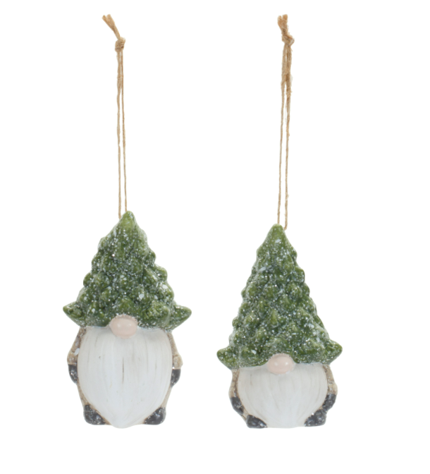 Two Christmas-themed gnomes with tree hats hanging on a white background