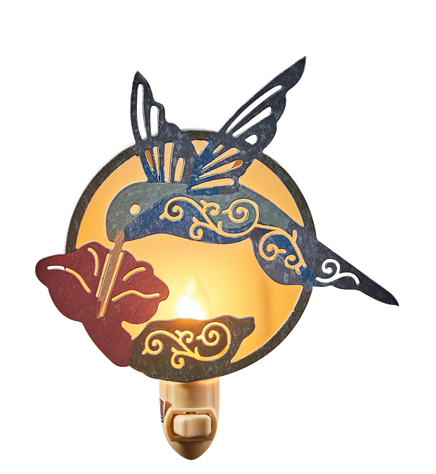 Decorative night light shaped like a hummingbird with floral design on a white background