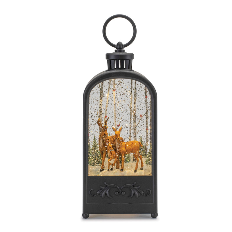 A black lighted snow globe featuring a deer and trees, with a Christmas-themed design.