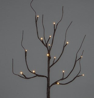Decorative branch with small lights against a dark background