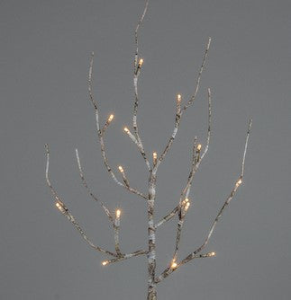 Decorative twig with small lights against a gray background