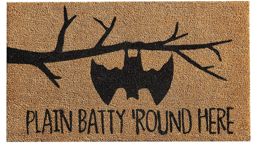 Doormat with bat design and text 'Plain Batty Round Here' on a beige background