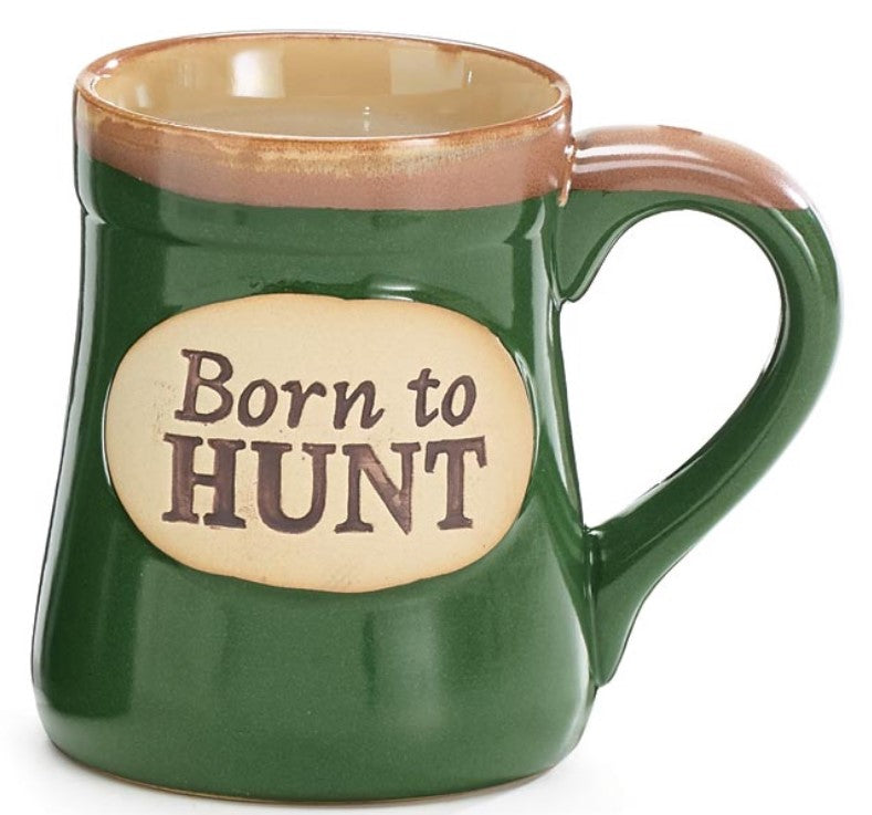 Green mug with 'Born to Hunt' text on a beige background