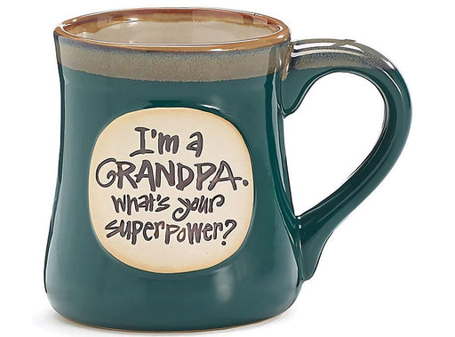 Green mug with text 'I'm a grandpa. What's your superpower?' on a beige background