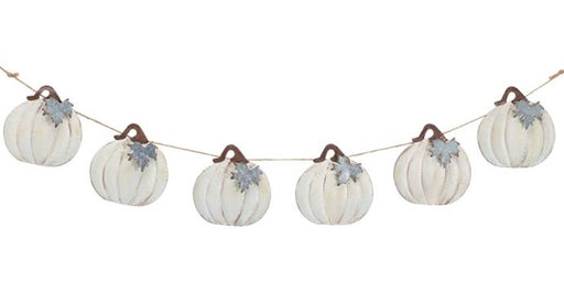 Decorative string with white pumpkins and brown stems on a white background