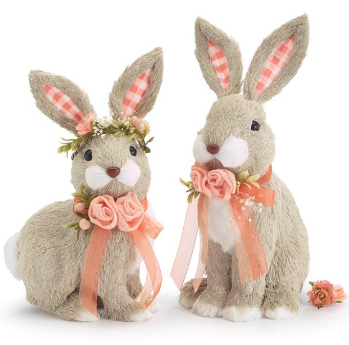 Two decorative rabbits with floral and bow accents on a white background