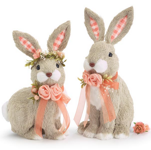 Two decorative rabbits with floral and bow accents on a white background