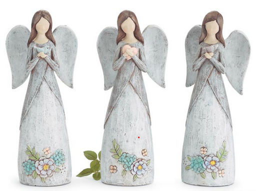 Three angel figurines with floral designs on a white background