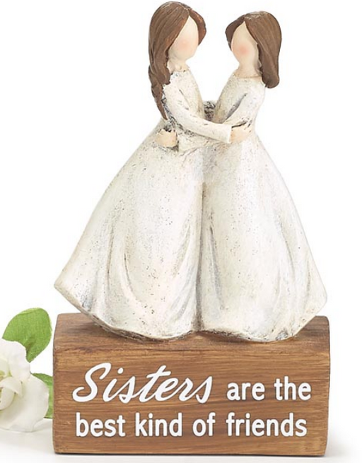 Decorative figurine of two women holding hands with a wooden base and text on a white background
