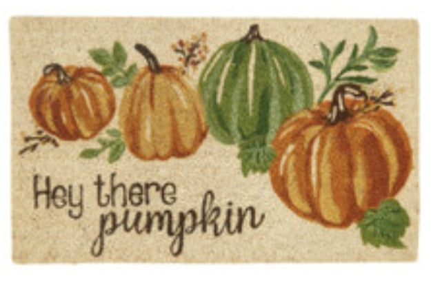 Doormat with pumpkins and the text 'Hey there pumpkin' on a beige background