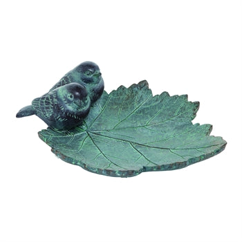 Decorative leaf-shaped object with a bird figure on a white background