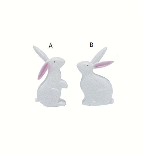 Two white rabbit figurines labeled A and B on a white background