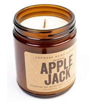 A jar candle with a red apple design label, titled 'Apple Jack - Country Home Candle'.