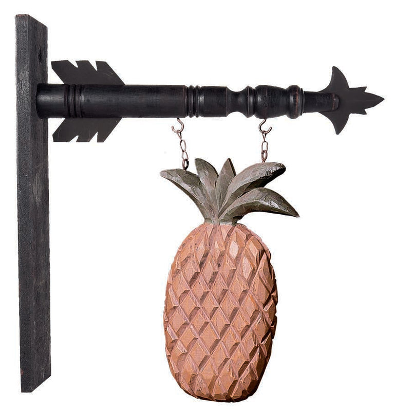 Decorative pineapple wall hook on a white background