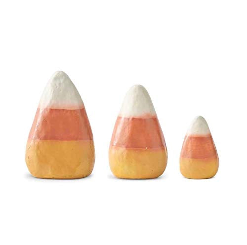 Three candy corn-shaped objects on a white background