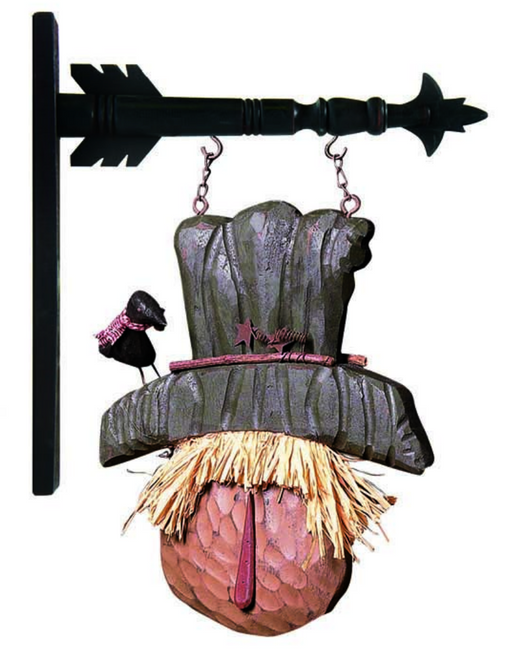Decorative wall hanging with a scarecrow and blackbird design on a white background