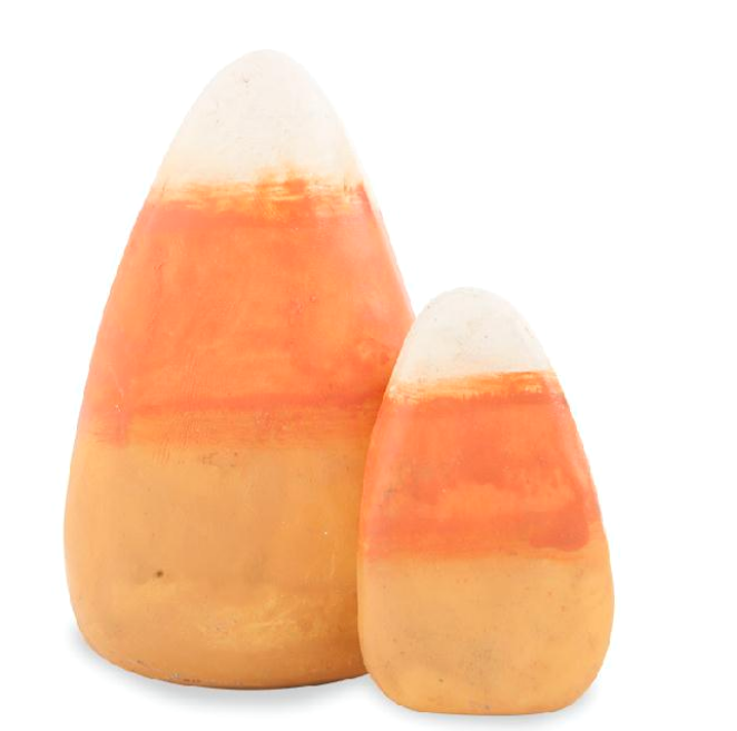 Two candy corn-shaped objects on a white background