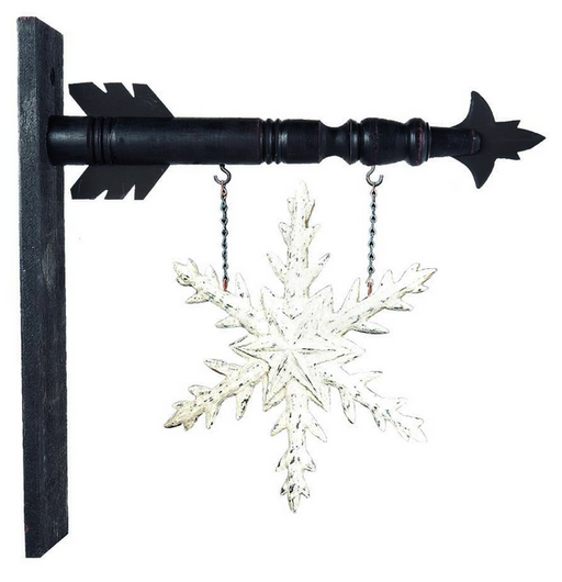 Decorative snowflake hanging from a black metal rod on a white background