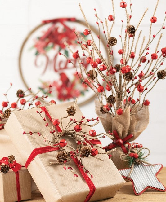 Decorative Christmas scene with wrapped gifts, red ribbons, and festive branches on a white background.