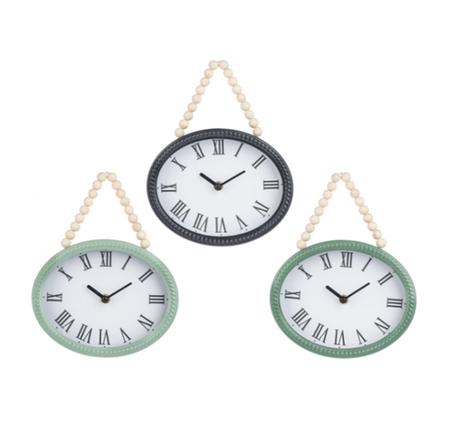 Three wall clocks with Roman numeral markings on a white background