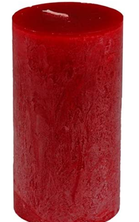 Red textured candle on a white background