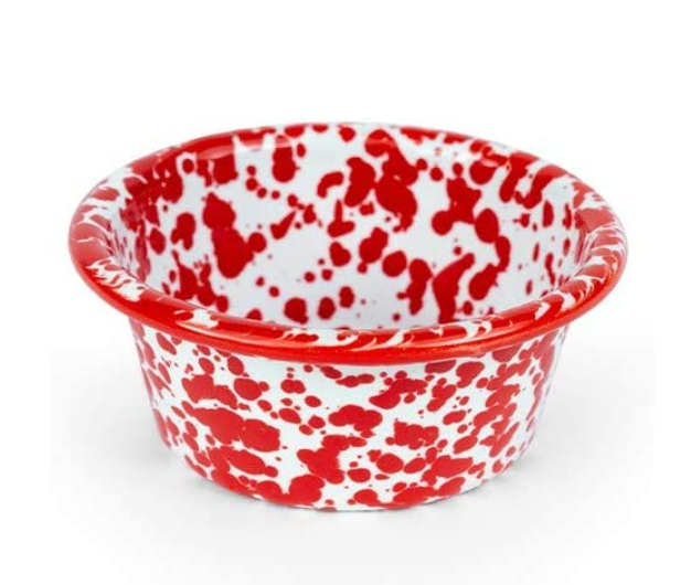 A red and white marbled enamelware ramekin on a white background.