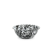 A black and white splattered enamel bowl on a white background.