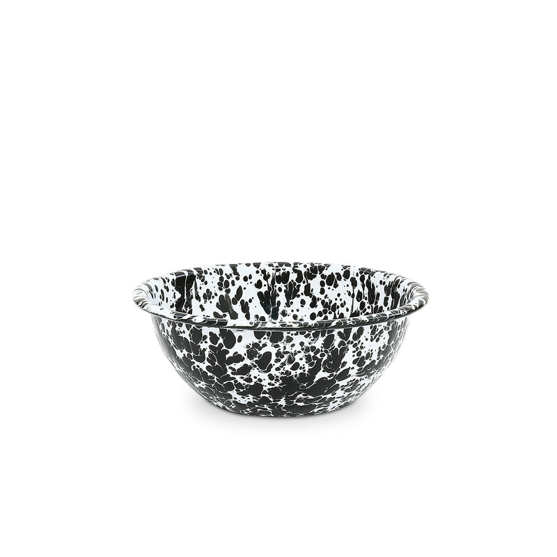 A black and white splattered enamel bowl on a white background.