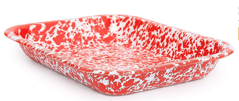 Rectangular baking dish with red and white speckled pattern on a white background