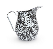 A black and white splatter pattern enamel pitcher
