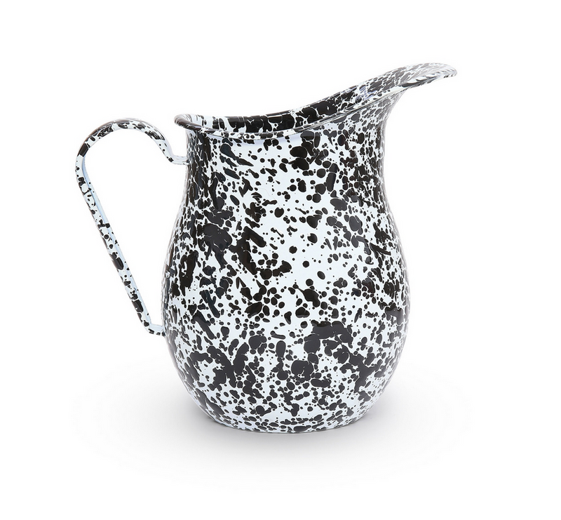 A black and white splatter pattern enamel pitcher