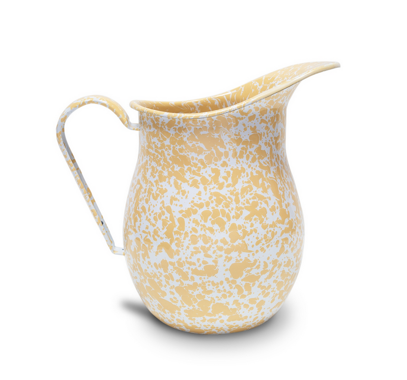 A red and white splatter pattern enamel pitcher