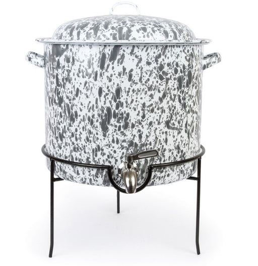 A grey and white speckled enamelware beverage dispenser with a metal rack.