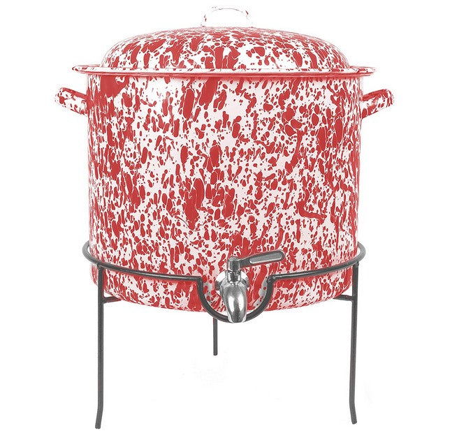 Red and white speckled cooler with a metal stand on a white background