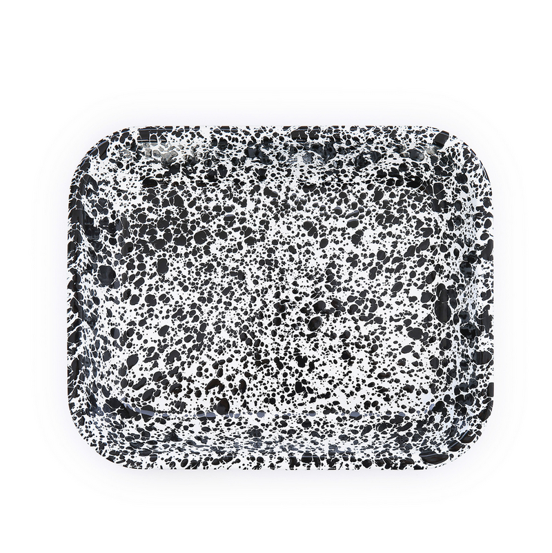 Speckled black and white rectangular tray on a white background