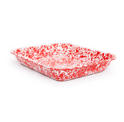 A red and white speckled enamel roasting pan.