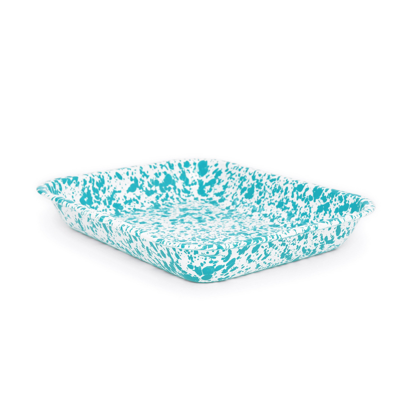 A blue and white speckled enamel roasting pan.