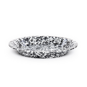 Speckled black and white ceramic plate on a white background