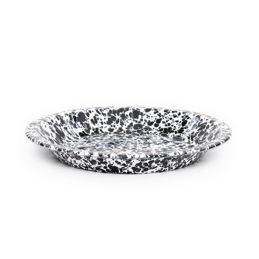 Speckled black and white ceramic plate on a white background