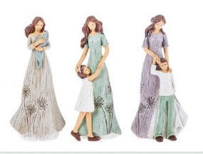 Three figurines of a woman with a child in various outfits on a white background