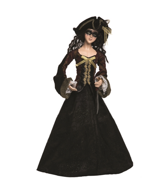 Doll in a black and gold dress with a white background