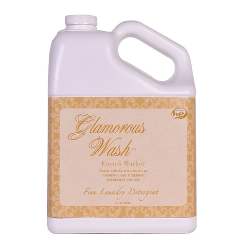 Jug of Glamorous Wash laundry detergent with decorative label on a white background