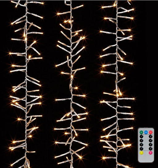 String lights with a remote control on a black background