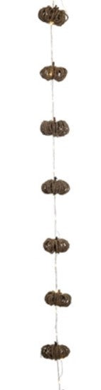 Decorative string with acorn-shaped beads on a white background