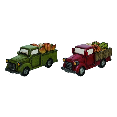 Two miniature model trucks, one green and one red, with cargo on a white background.