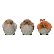 Three small animal figurines on a white background
