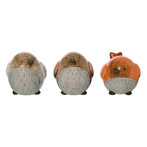 Three small animal figurines on a white background