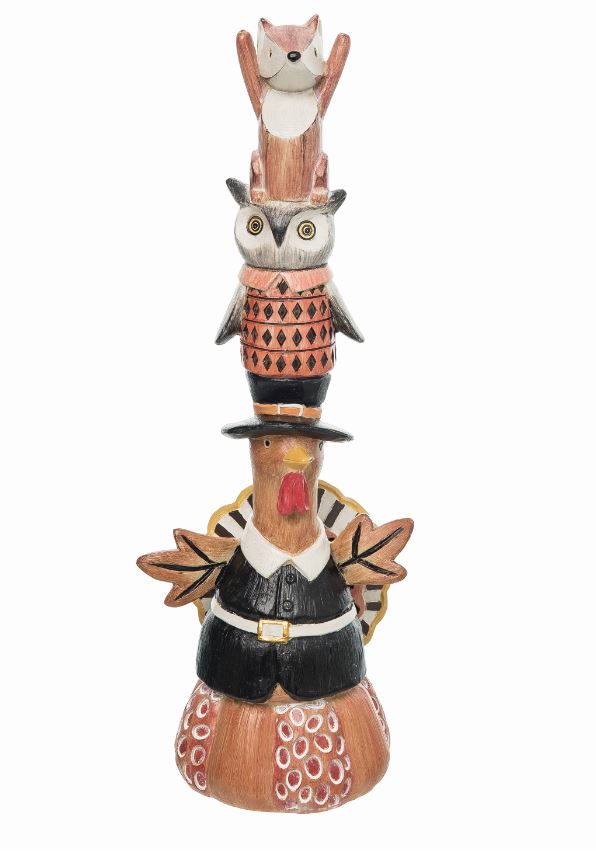 Decorative totem pole figurine with animal heads stacked on a white background