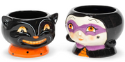 Two Halloween-themed ceramic pots, one black cat and one witch, on a white background.